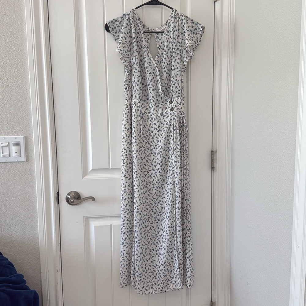 Cream colored long dress with blue flowers